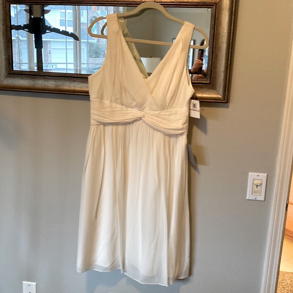 Beautiful white very flattering chiffon dress.